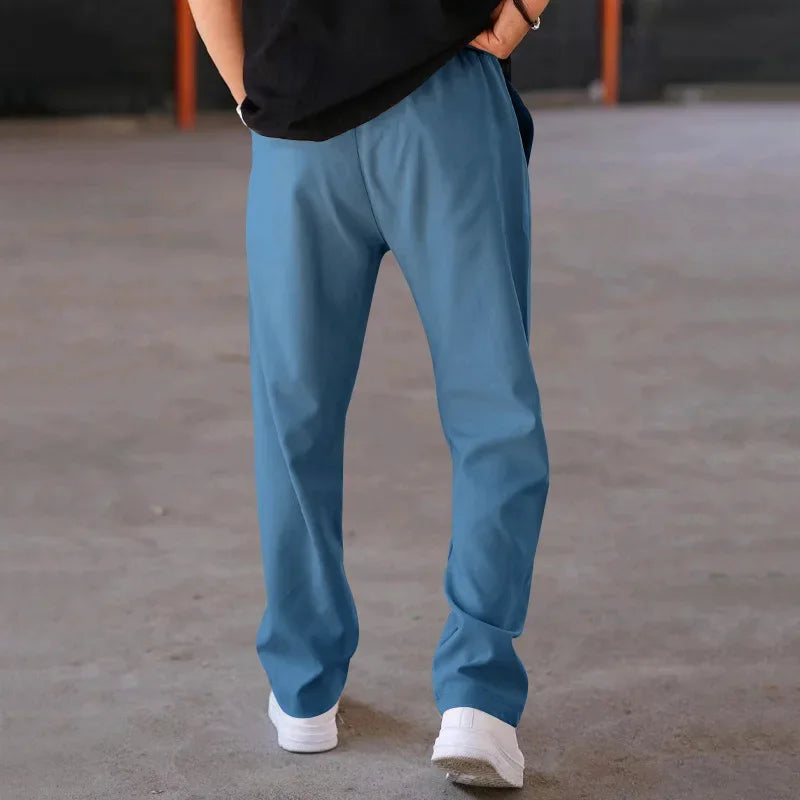 Pantalon homme coupe ample style costume avec cordon de serrage et plis marqués