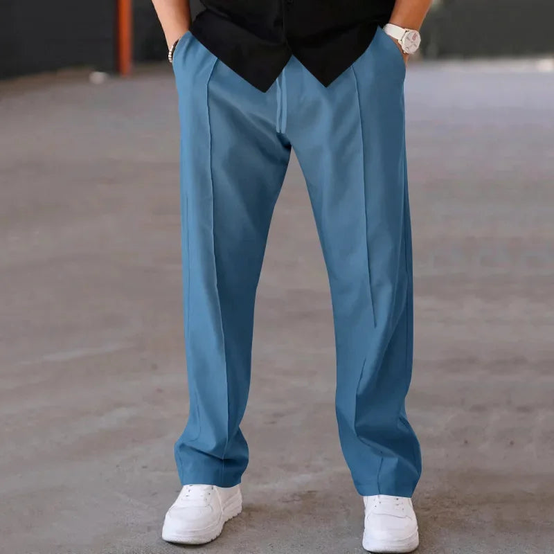 Pantalon homme coupe ample style costume avec cordon de serrage et plis marqués