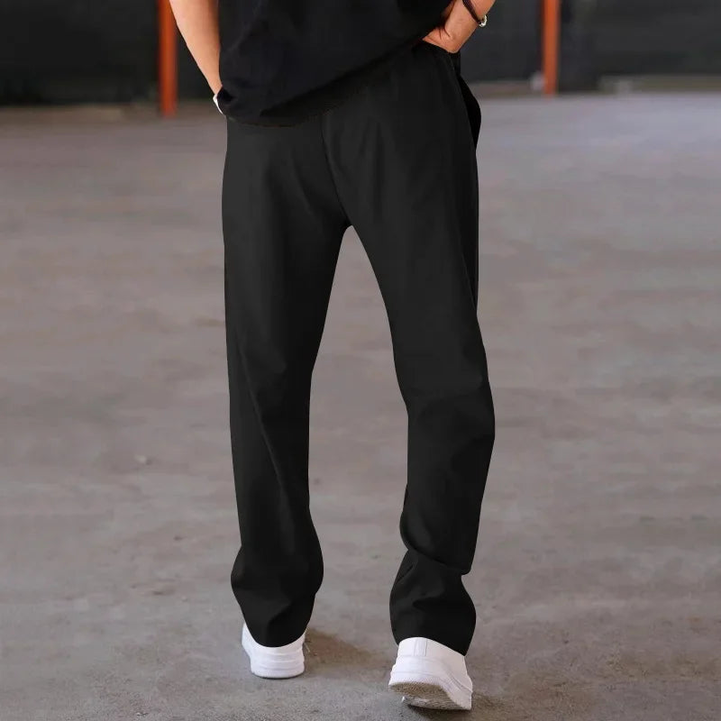 Pantalon homme coupe ample style costume avec cordon de serrage et plis marqués