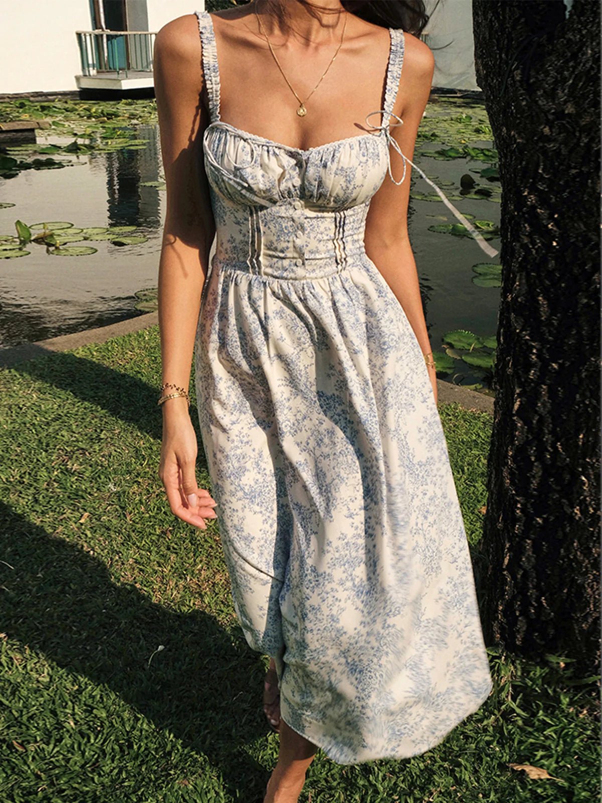 Robe midi femme imprimé floral bretelles fines taille smockée boutonnée devant