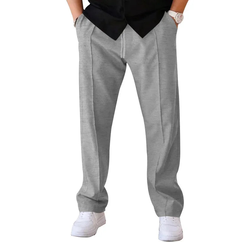 Pantalon homme coupe ample style costume avec cordon de serrage et plis marqués
