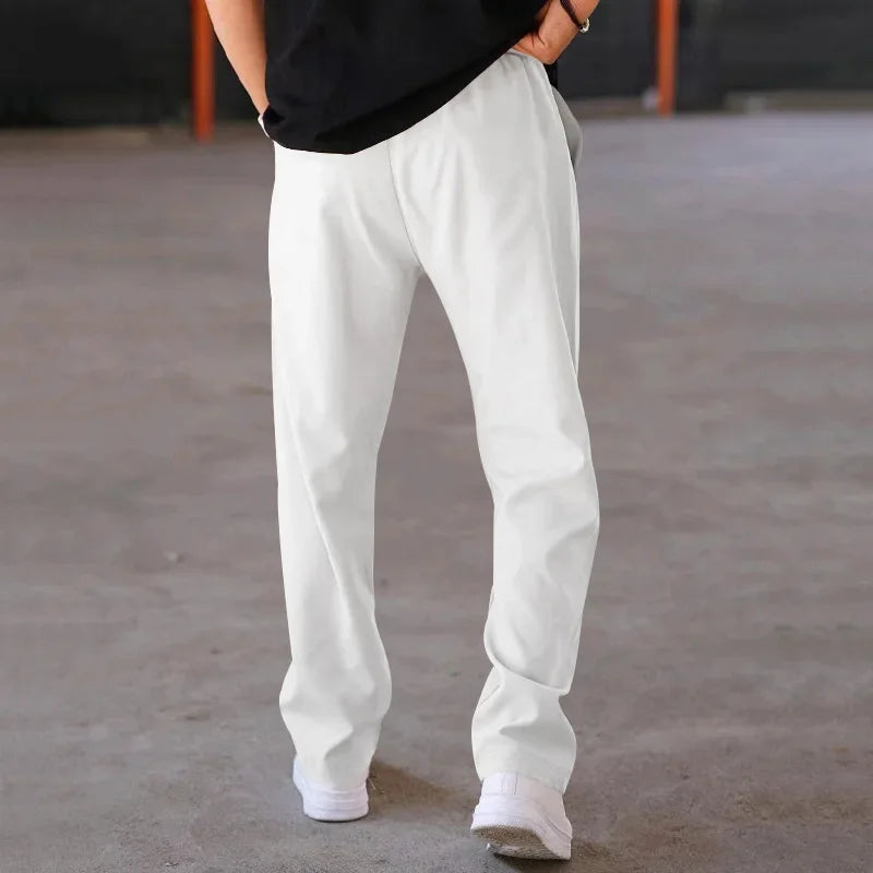 Pantalon homme coupe ample style costume avec cordon de serrage et plis marqués
