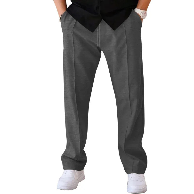 Pantalon homme coupe ample style costume avec cordon de serrage et plis marqués